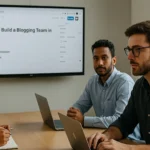 A diverse blogging team meeting in a modern office with a WordPress editor on screen showing 'How to Build a Blogging Team in 2025
